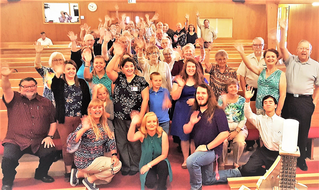 St. James church members wave to the camera